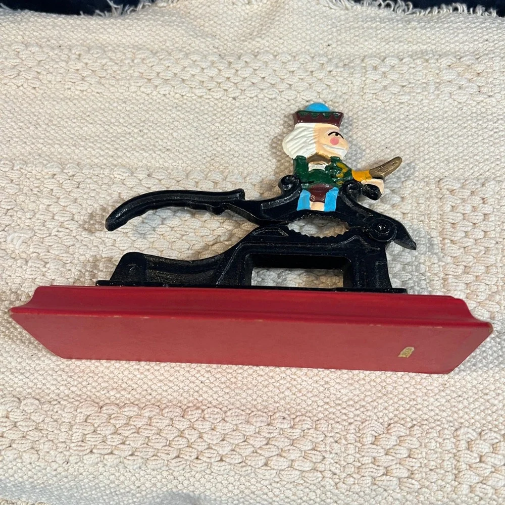 Vintage Cast Iron Nutcracker on Red Wood Base Hand Painted‎ Decor